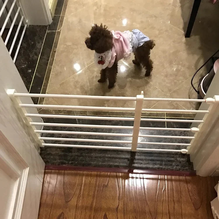 Jelieora Venture retractable pet safety gate extended across doorway, made of durable mesh and lightweight material for pet containment.