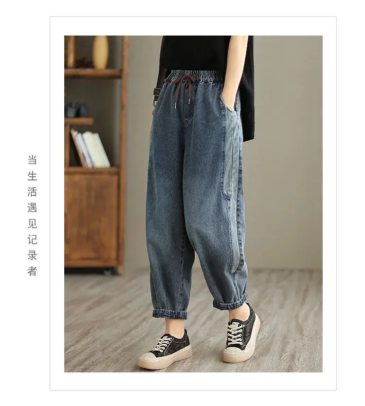 Women's denim harem pants by Jelieora Venture featuring relaxed fit and stylish design, shown in a light wash denim fabric.