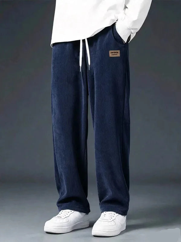 Men's straight leg corduroy trousers by Jelieora Venture, shown in dark brown with a classic fit and textured fabric.