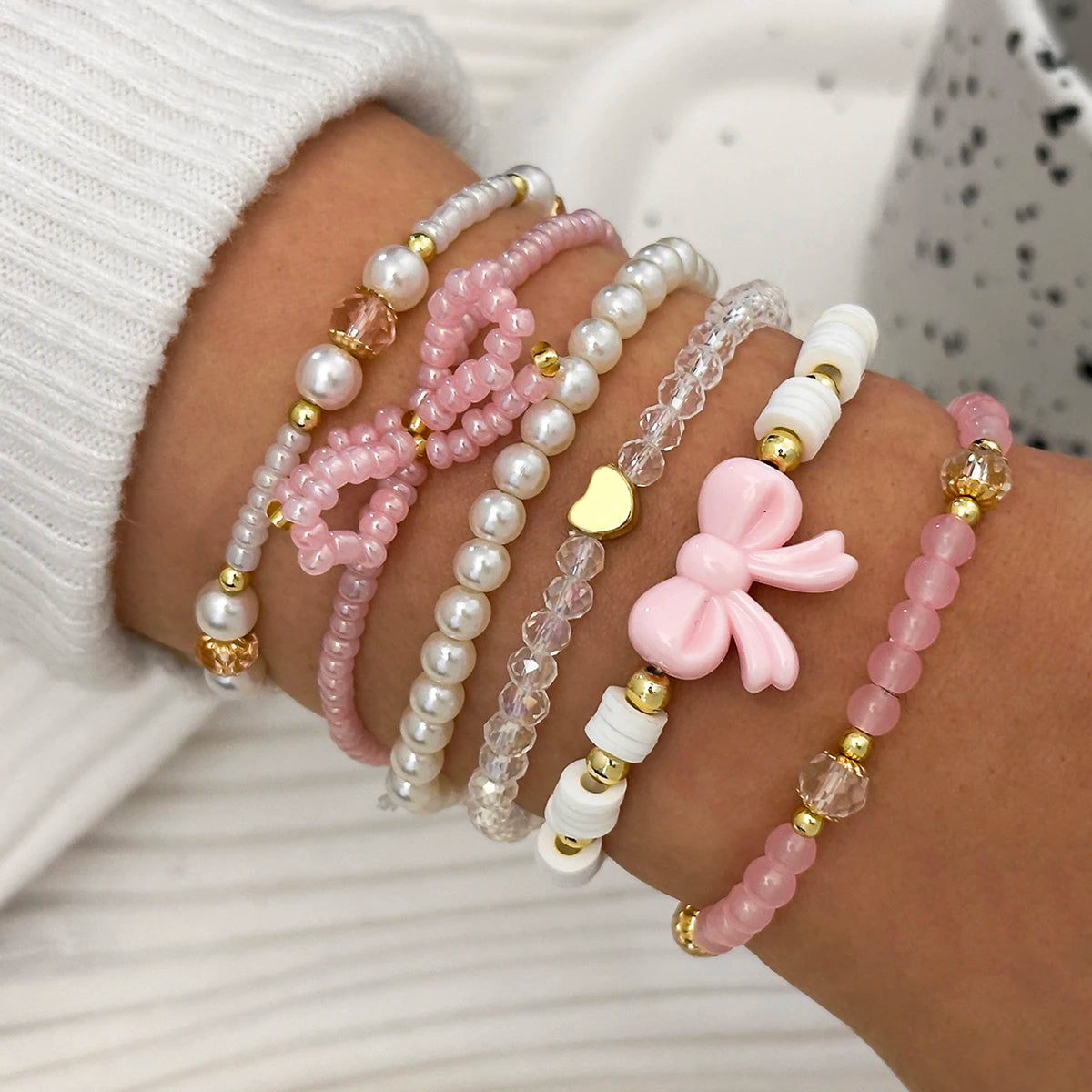 Set of six cute pearl love beaded bow bracelets for women, featuring simple and sweet jewelry designs by Jelieora Venture.