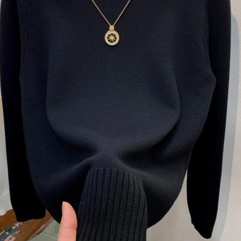 Women's turtleneck knit pullover sweater by Jelieora Venture, featuring a cozy, fitted design and ribbed collar in soft fabric.