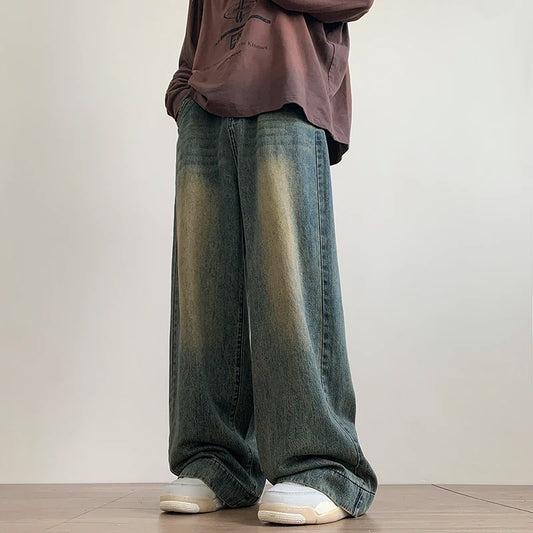 Men's distressed wide-leg baggy jeans by Jelieora Venture, showcasing a relaxed fit with ripped details and casual style.