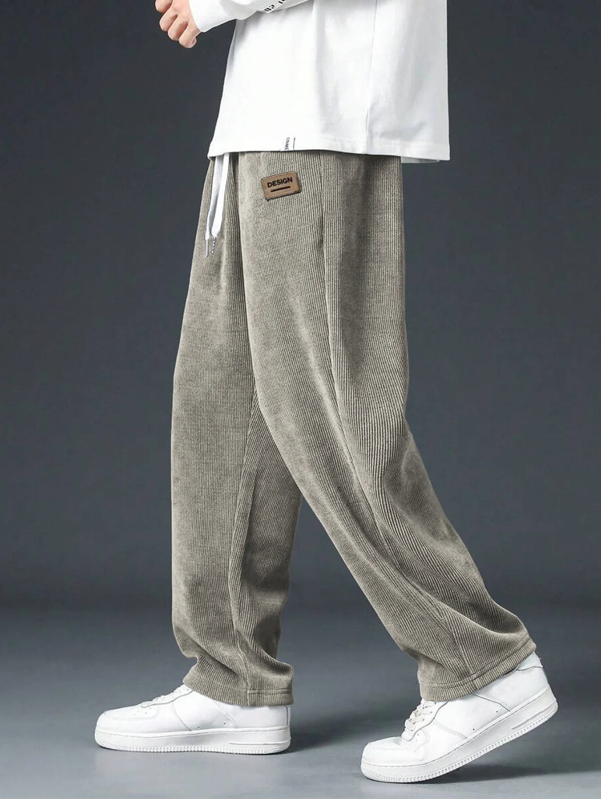 Men's straight leg corduroy trousers by Jelieora Venture, shown in a classic fit with textured fabric and front pockets.