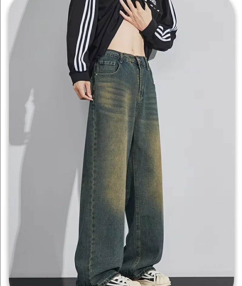 Men's distressed wide leg jeans by Jelieora Venture, showing frayed details and relaxed fit in a casual denim style.