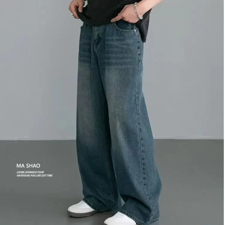Men's distressed wide leg jeans by Jelieora Venture showing faded denim, frayed details, and relaxed fit style.