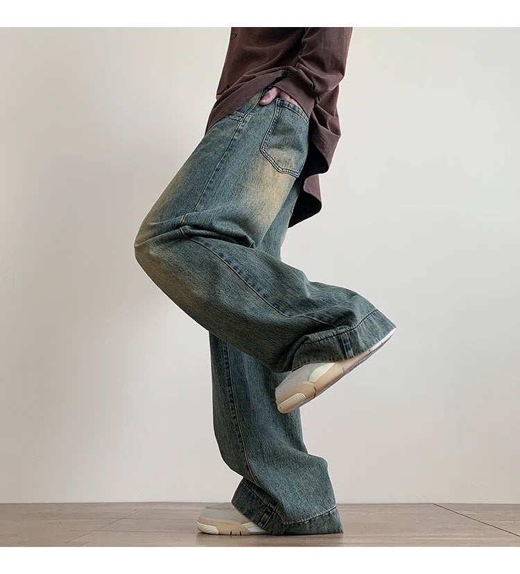 Men's distressed wide-leg baggy jeans by Jelieora Venture, featuring a relaxed fit and rugged, worn-in denim style.