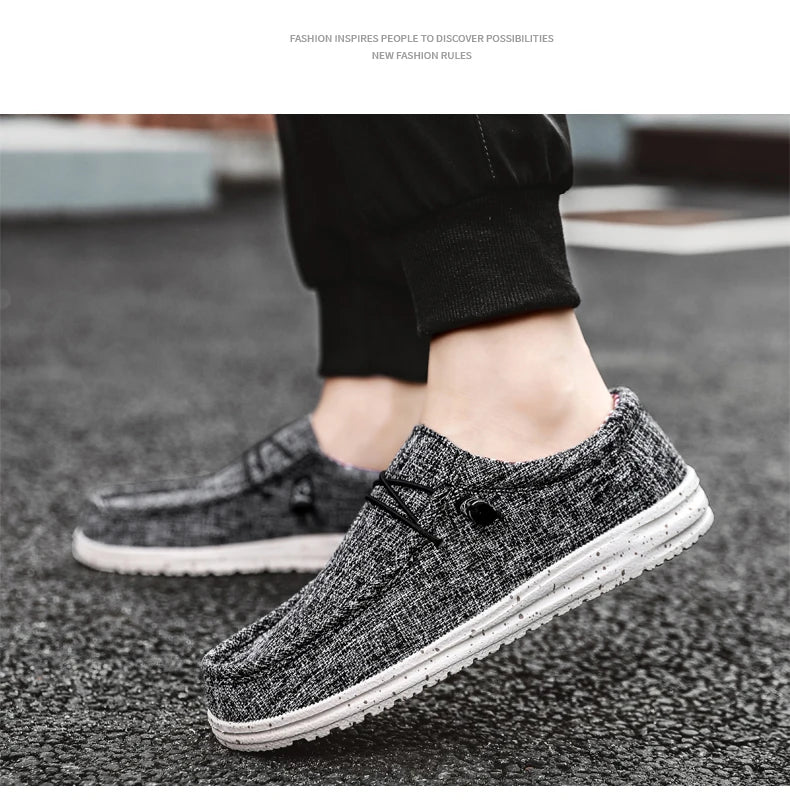 Men's denim canvas trainers by Jelieora Venture featuring white rubber soles and classic lace-up design.