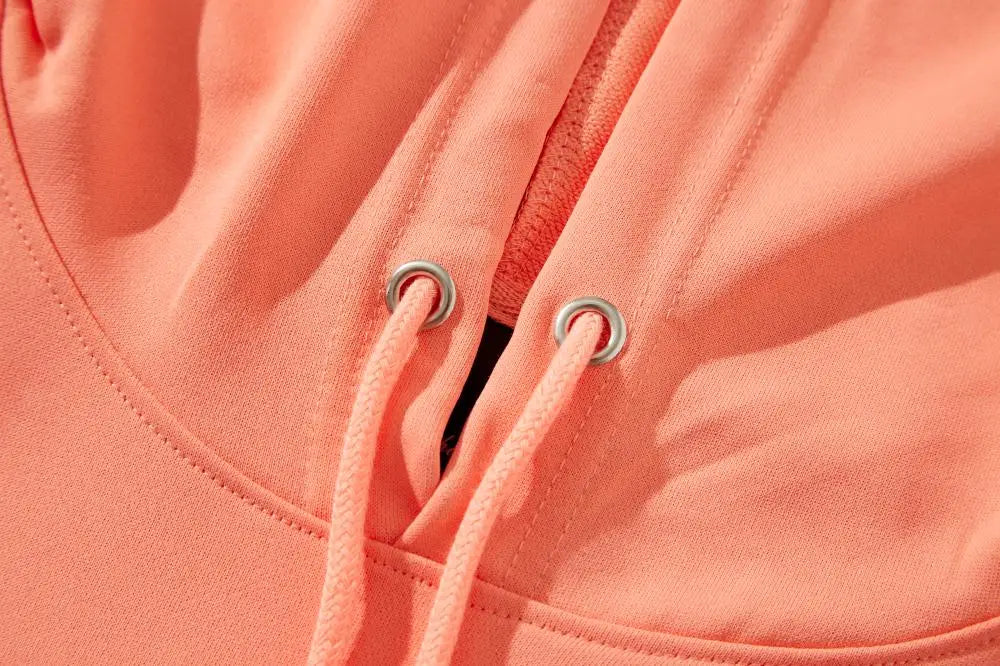 Men's Jelieora Venture tracksuit hoodie in black, featuring a zip-up front and adjustable drawstrings, displayed on a hanger.