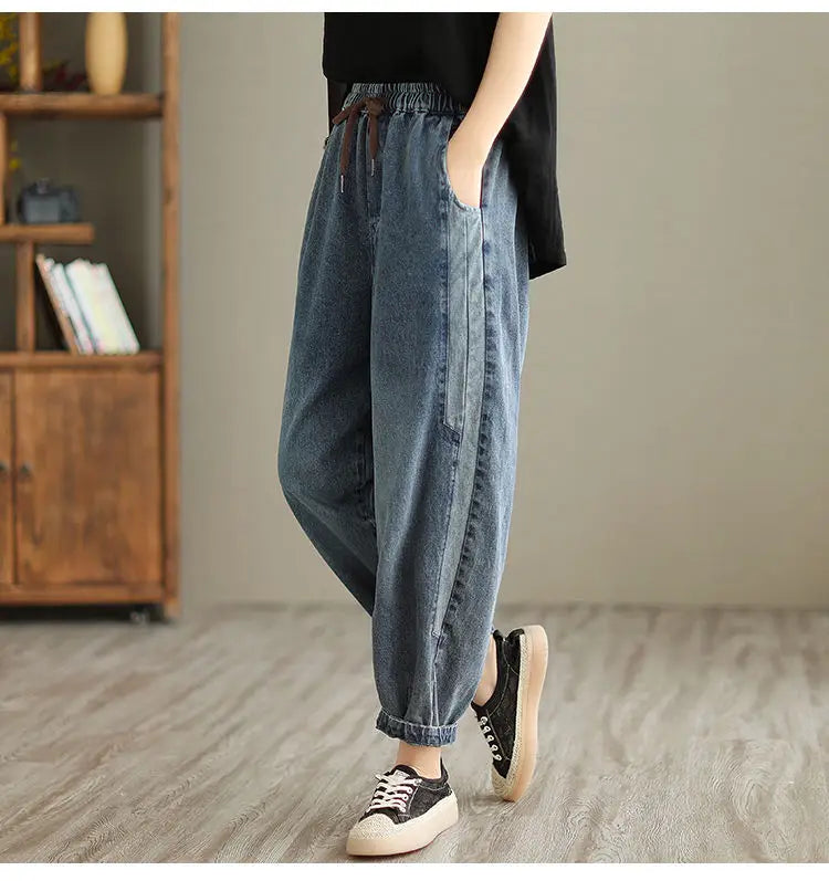 Women's denim harem pants by Jelieora Venture featuring relaxed fit and stylish design, shown in a casual outfit.