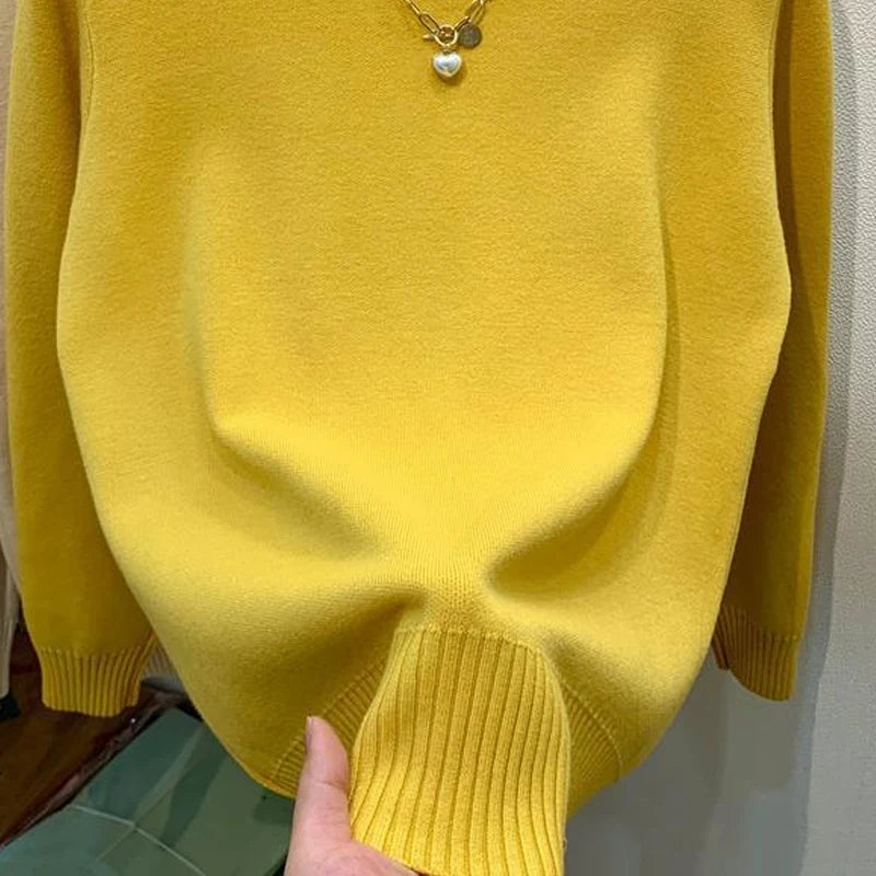 Women's navy turtleneck knit pullover sweater by Jelieora Venture, showing close-up of soft, ribbed collar and cozy fabric.