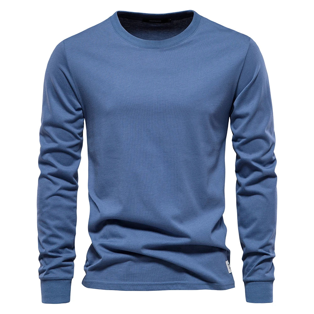 Men's cotton long sleeve T-shirt by Jelieora Venture, showing a comfortable fit in a neutral color, close-up of fabric and sleeve details.