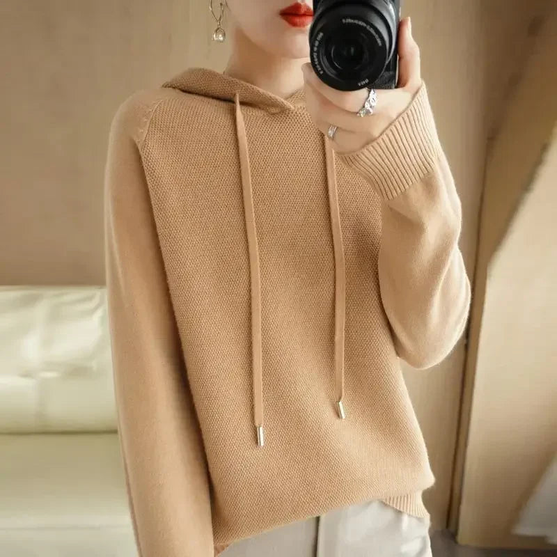 Women's knitted hoodie jumper by Jelieora Venture, featuring a cozy, stylish design in a soft, textured knit fabric.