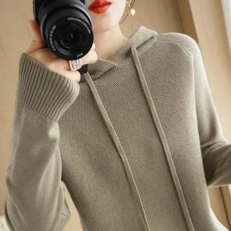 Women's knitted hoodie jumper by Jelieora Venture, featuring a cozy, textured knit fabric and a relaxed fit.