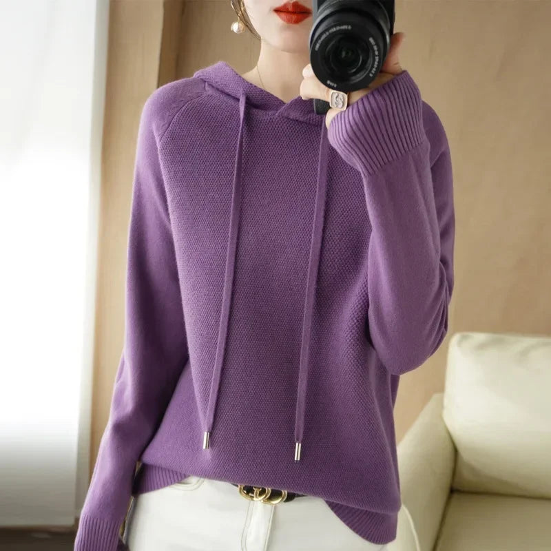 Women's knitted hoodie jumper by Jelieora Venture, featuring a cozy, textured knit fabric and a relaxed fit.