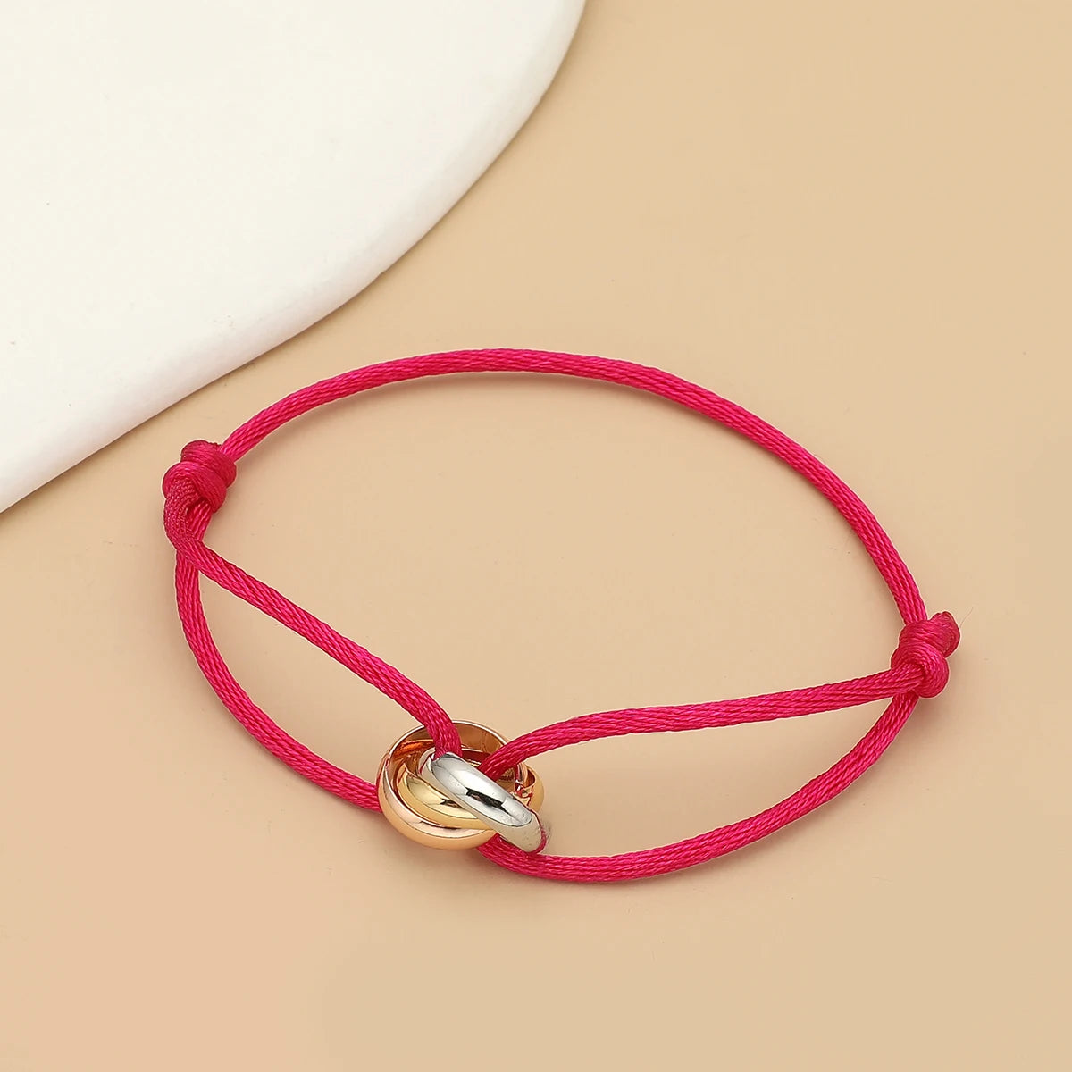 Simple fashion unisex bracelet by Jelieora Venture featuring three metal round circles on a rope design, adjustable jewelry accessory
