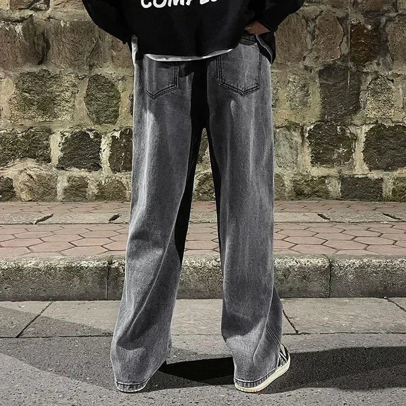 Men's wide-leg streetwear jeans by Jelieora Venture, showing a relaxed fit with distressed details and classic denim texture.