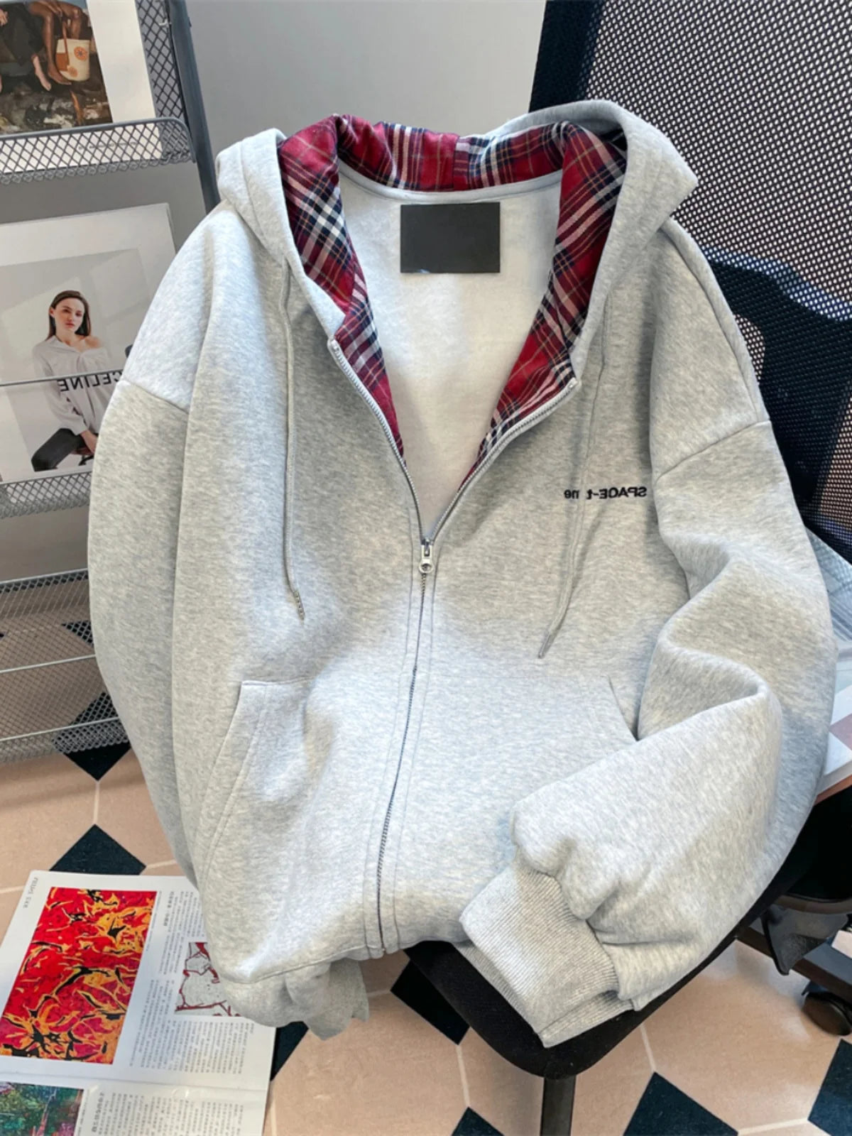 Retro plaid zip hoodie cardigan by Jelieora Venture, featuring a cozy, colorful plaid pattern and a front zipper closure.