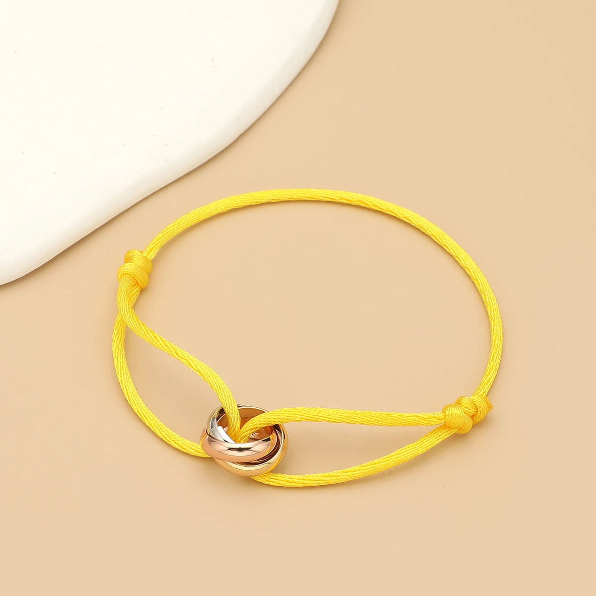 Unisex Jelieora Venture bracelet with three metal round circle charms on adjustable rope, suitable for men and women jewelry.