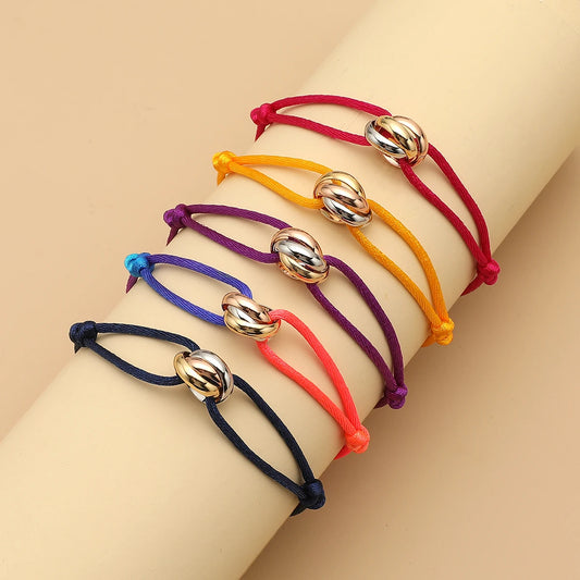 Unisex Jelieora Venture bracelet with three metal round circles on adjustable rope, stylish jewelry accessory for men and women.