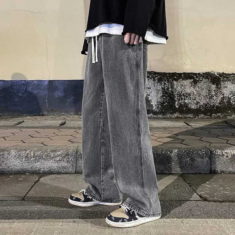 Men's wide leg streetwear jeans by Jelieora Venture, shown in dark denim with relaxed fit and stylish design.