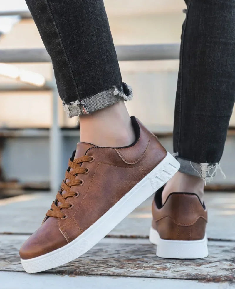 Men's leather loafer shoes by Jelieora Venture, showcasing classic design with smooth brown leather and slip-on style.