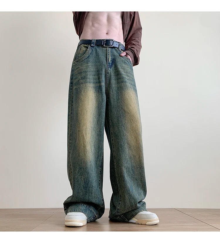 Men's distressed wide-leg baggy jeans by Jelieora Venture, featuring a relaxed fit and worn-in distressed detailing.