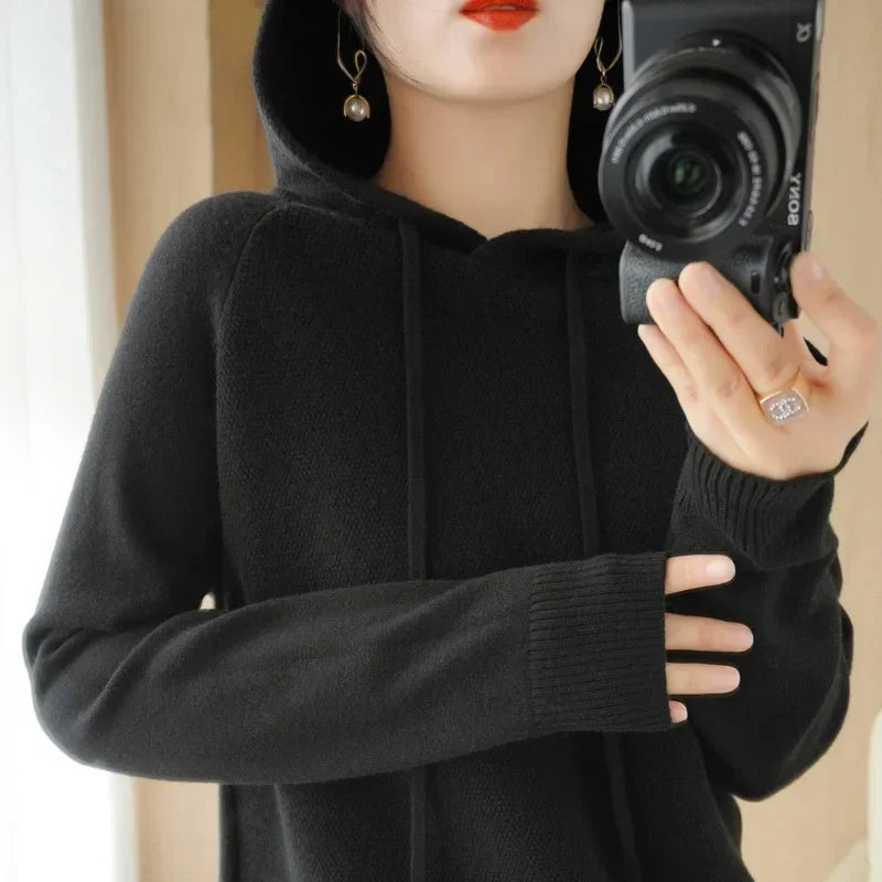 Women’s knitted hoodie jumper from Jelieora Venture featuring a cozy, soft fabric with a hood and long sleeves, in neutral color.