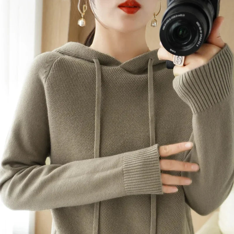 Women's knitted hoodie jumper by Jelieora Venture featuring a cozy, stylish design and a front pocket, ideal for casual wear.