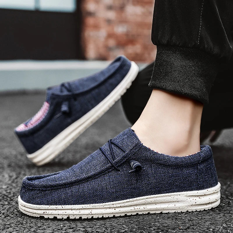 Men's denim canvas trainers by Jelieora Venture featuring casual lace-up design and durable rubber soles.