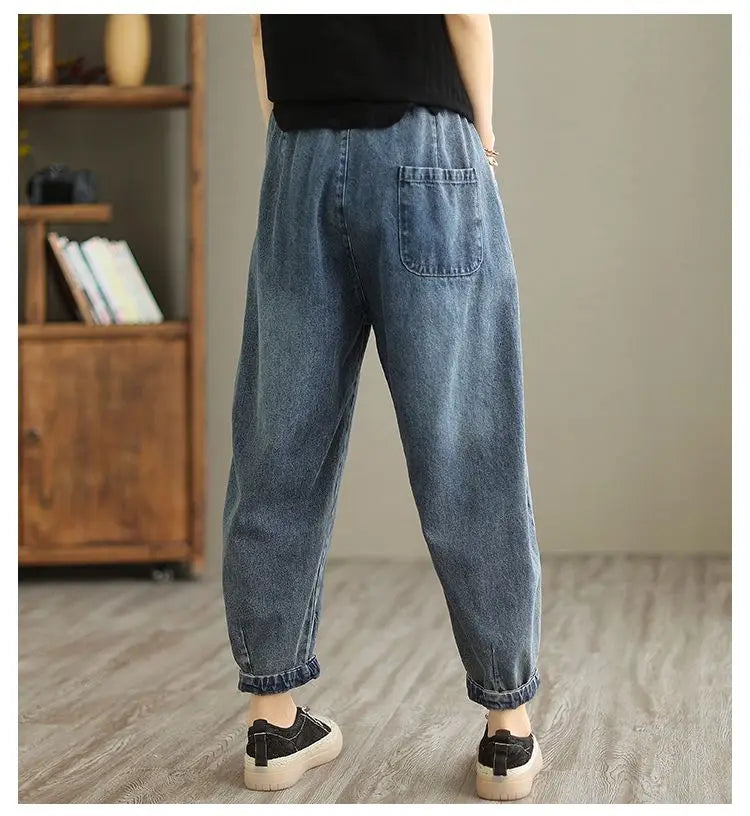 Women’s denim harem pants by Jelieora Venture featuring relaxed fit and stylish design, shown on a model in a casual setting.