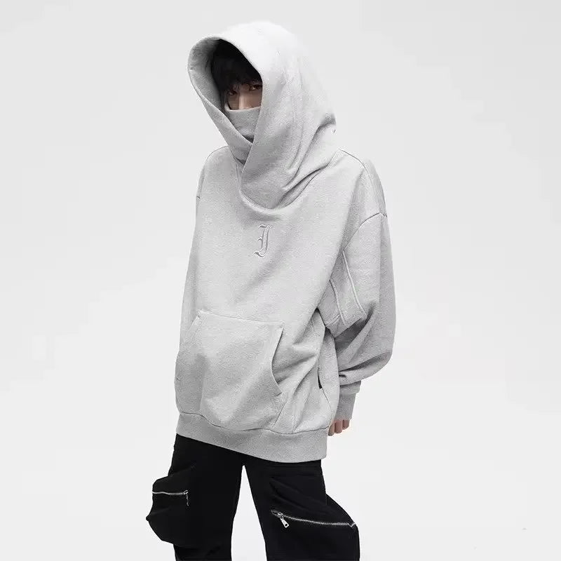 Men's turtleneck hoodie by Jelieora Venture, featuring a cozy design in a dark color, shown on a model.