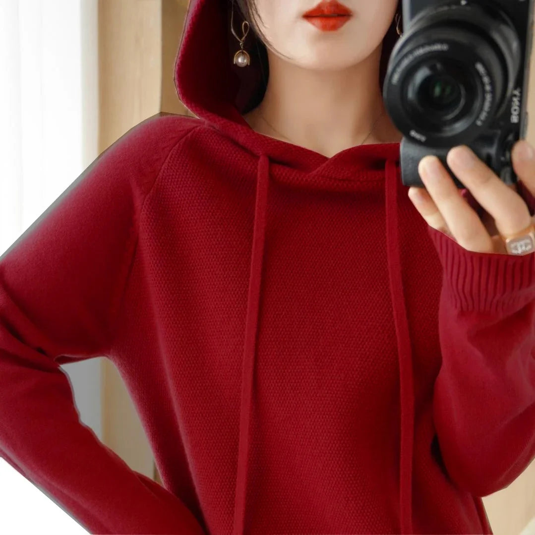 Women's knitted hoodie jumper by Jelieora Venture, featuring a cozy, soft fabric with a fitted hood and long sleeves.
