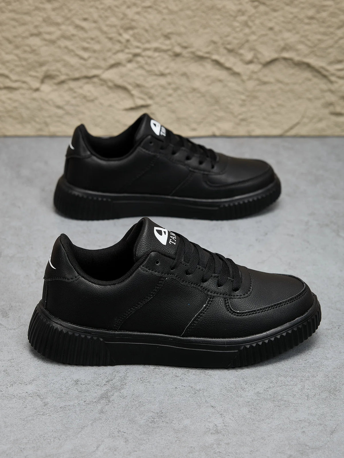 Men's white leather sneakers by Jelieora Venture showing smooth leather uppers and casual sole design.