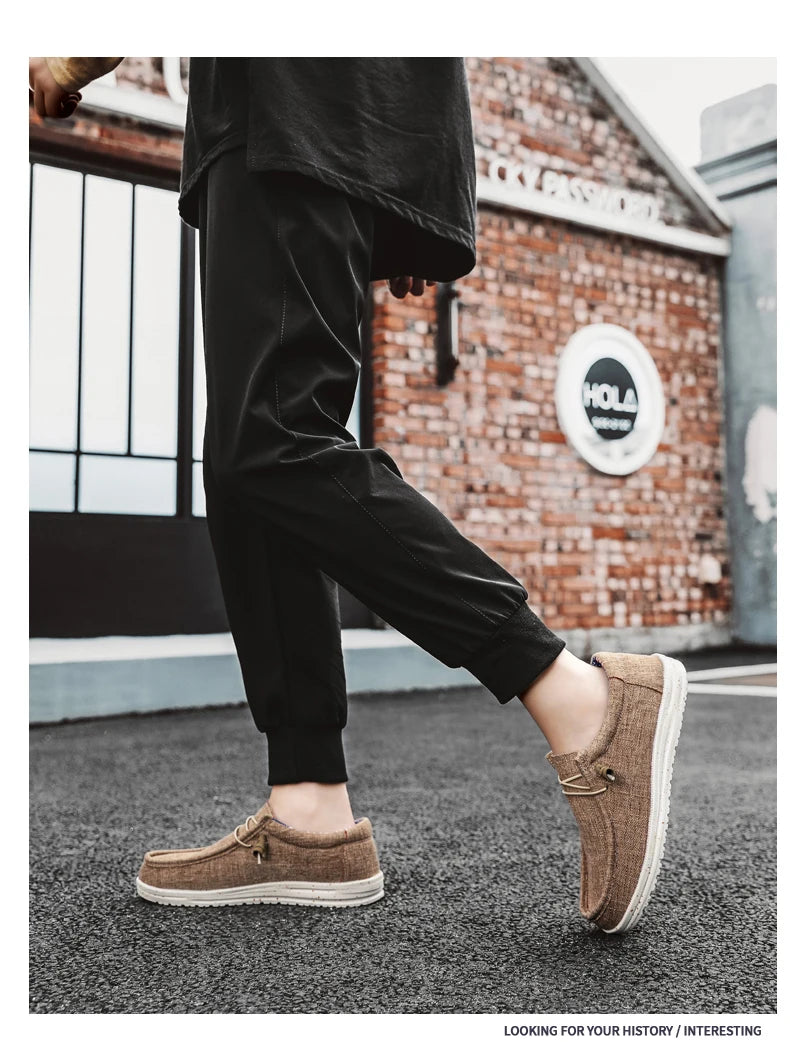 Men's denim canvas trainers by Jelieora Venture featuring casual slip-on style, white rubber soles, and stitched detailing.