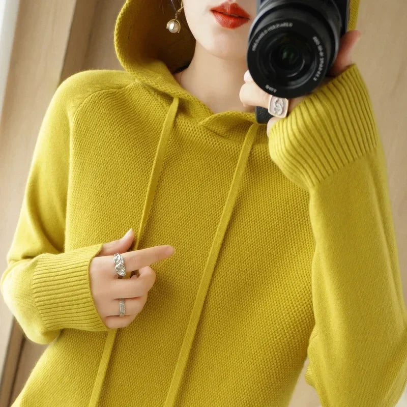 Women's knitted hoodie jumper by Jelieora Venture featuring a cozy, stylish design with a hood and ribbed cuffs.