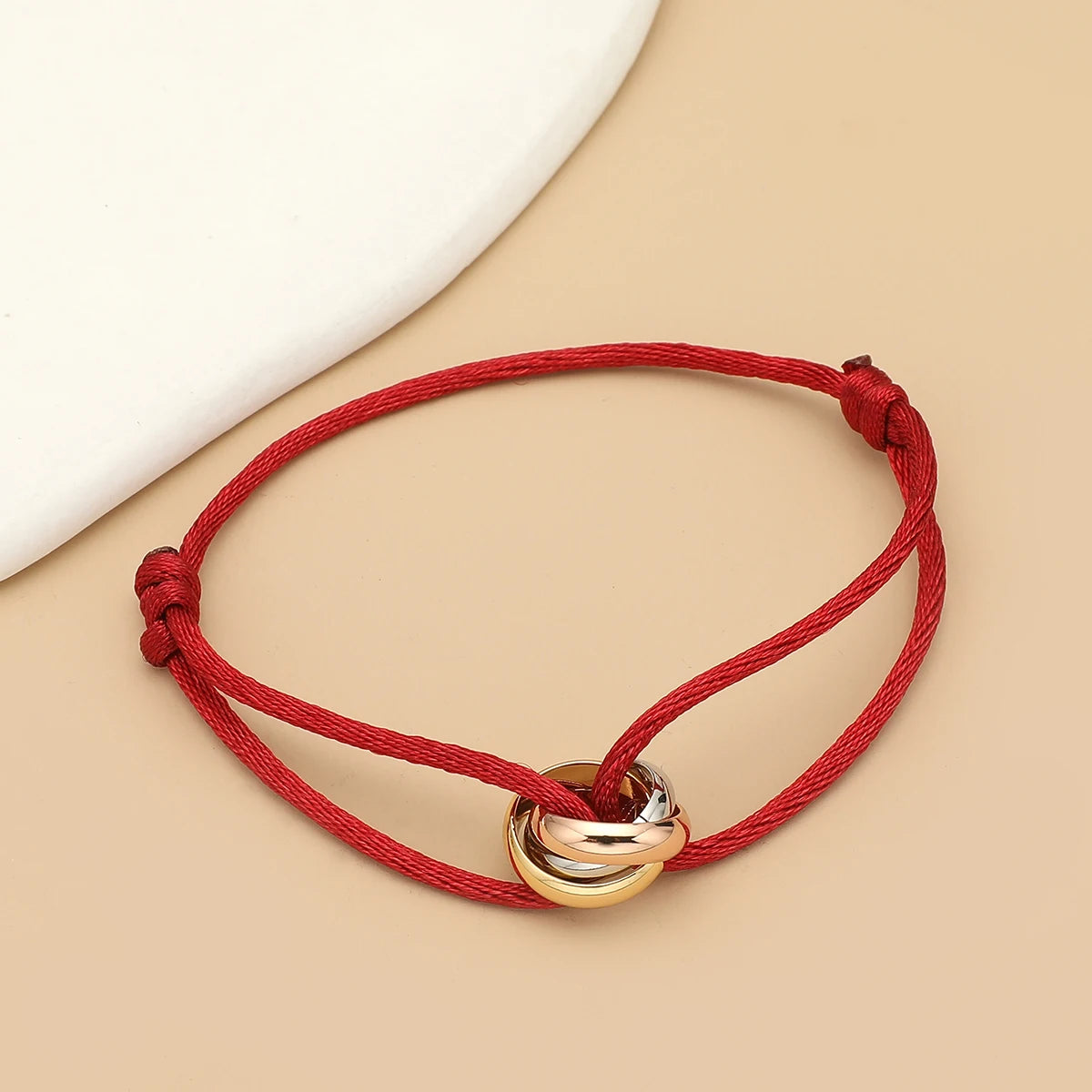 Unisex Jelieora Venture bracelet with three metal round circles on adjustable rope, stylish jewelry accessory for men and women