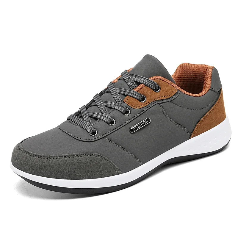 Men's waterproof trainers by Jelieora Venture, showing navy blue athletic shoes with waterproof material and sturdy soles.