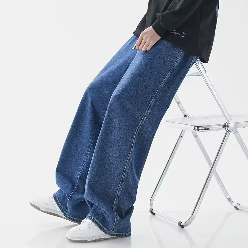Men's baggy wide-leg Y2K denim jeans by Jelieora Venture, showcasing relaxed fit, distressed details, and classic blue wash.