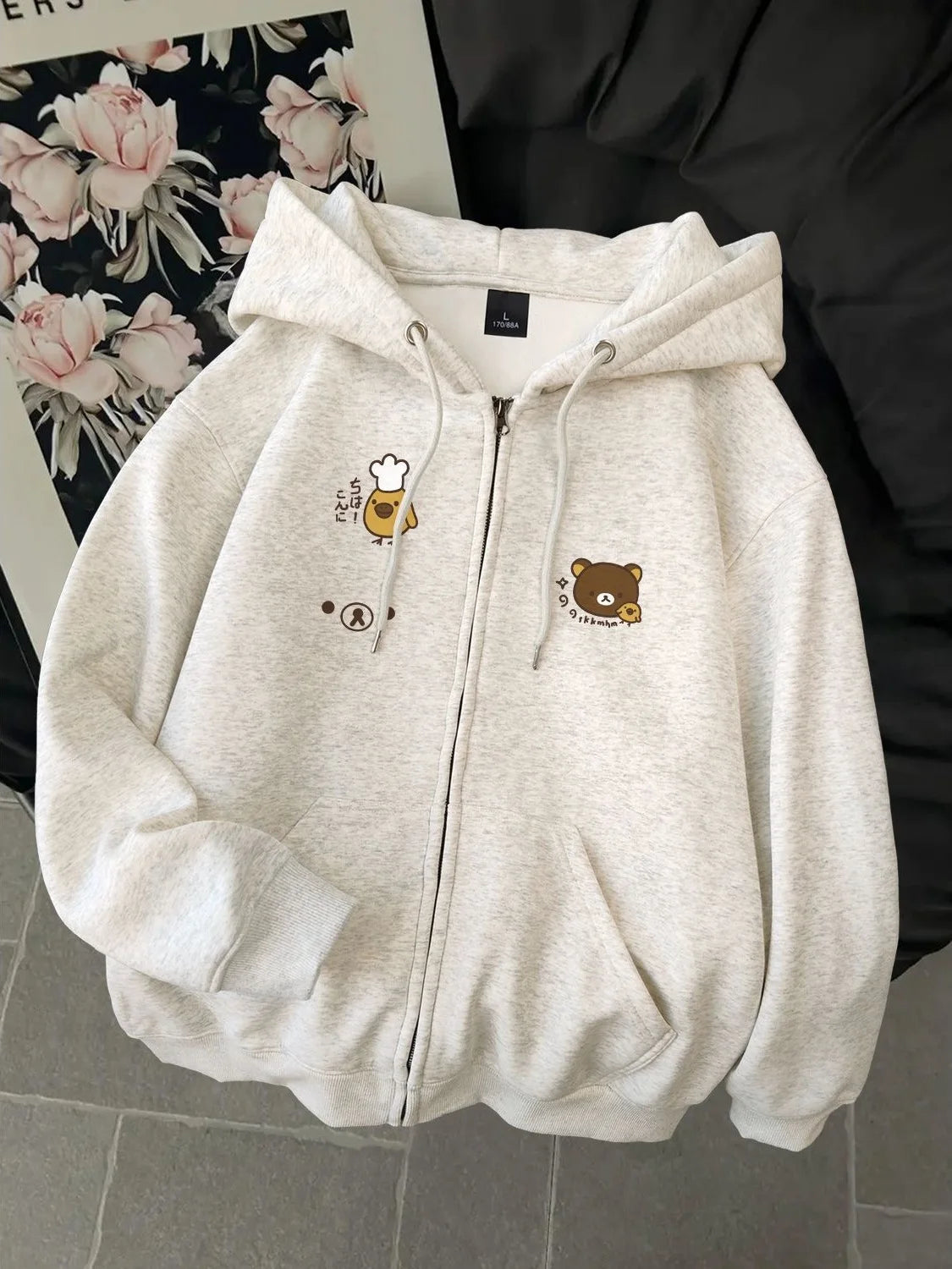 Women's dog print zip hoodie by Jelieora Venture featuring a cozy design with dog illustrations on the front.