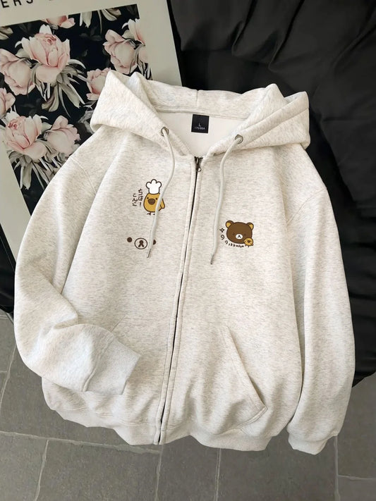Women's dog print zip hoodie by Jelieora Venture featuring a cozy design with dog illustrations on the front.