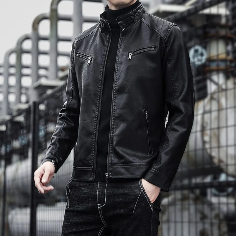 Men's black faux leather biker jacket by Jelieora Venture, featuring classic collar and zippered front, displayed hanging on a wooden hanger.