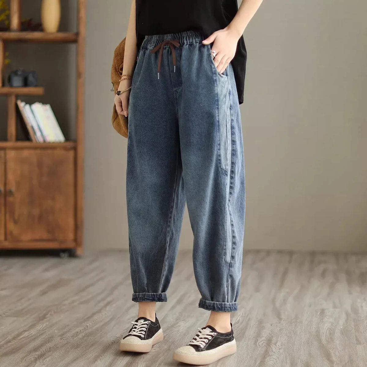 Women's denim harem pants by Jelieora Venture featuring a relaxed fit and stylish design in classic blue denim.