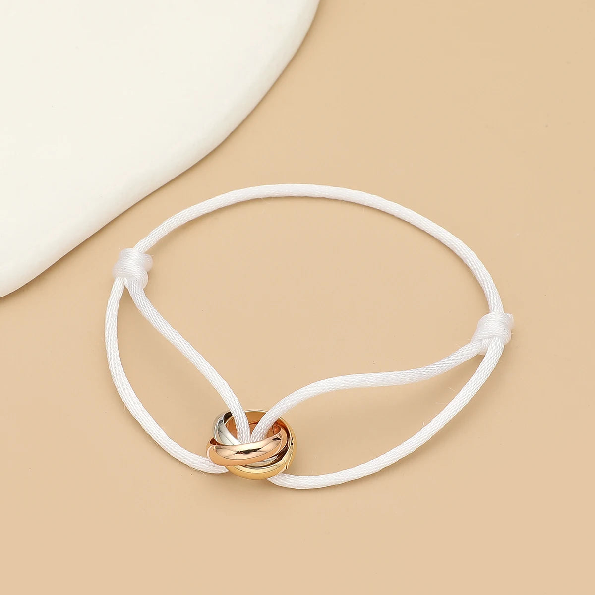 Unisex bracelet with three metal round circles on adjustable rope, jewelry accessory for men and women by Jelieora Venture