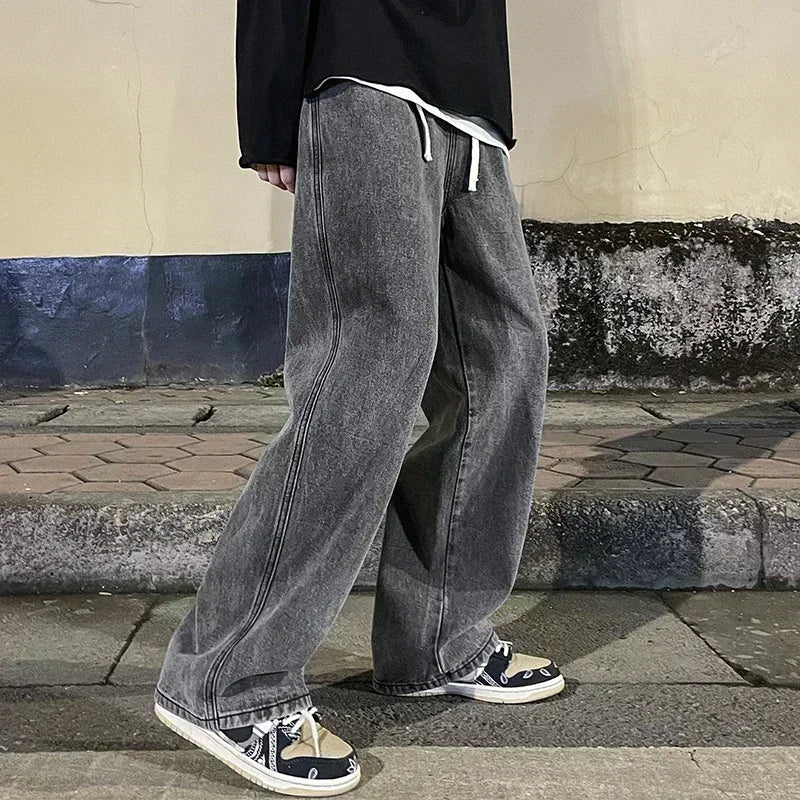 Men's wide-leg streetwear jeans by Jelieora Venture, showing relaxed fit denim with a casual, trendy style.