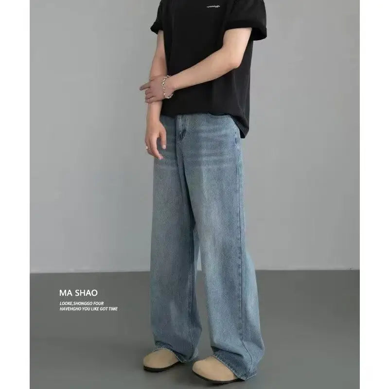 Men's distressed wide leg jeans by Jelieora Venture featuring a relaxed fit and ripped details, shown on a model.