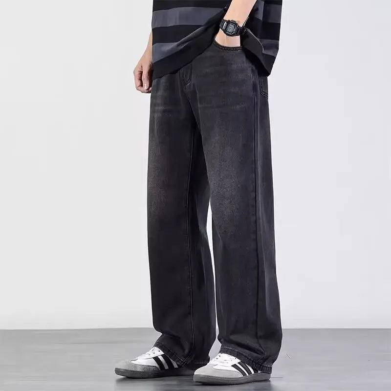 Men's distressed wide-leg jeans by Jelieora Venture featuring a relaxed fit and frayed details on the denim fabric.