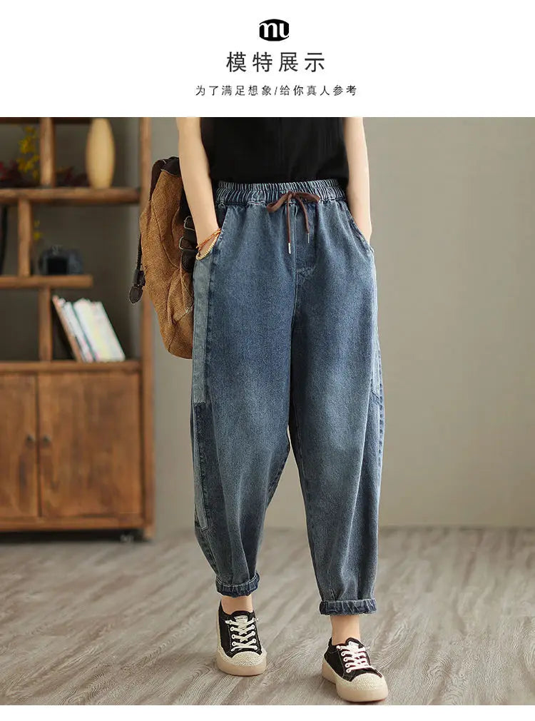 Women's denim harem pants by Jelieora Venture featuring a relaxed fit and stylish design, shown on a model.