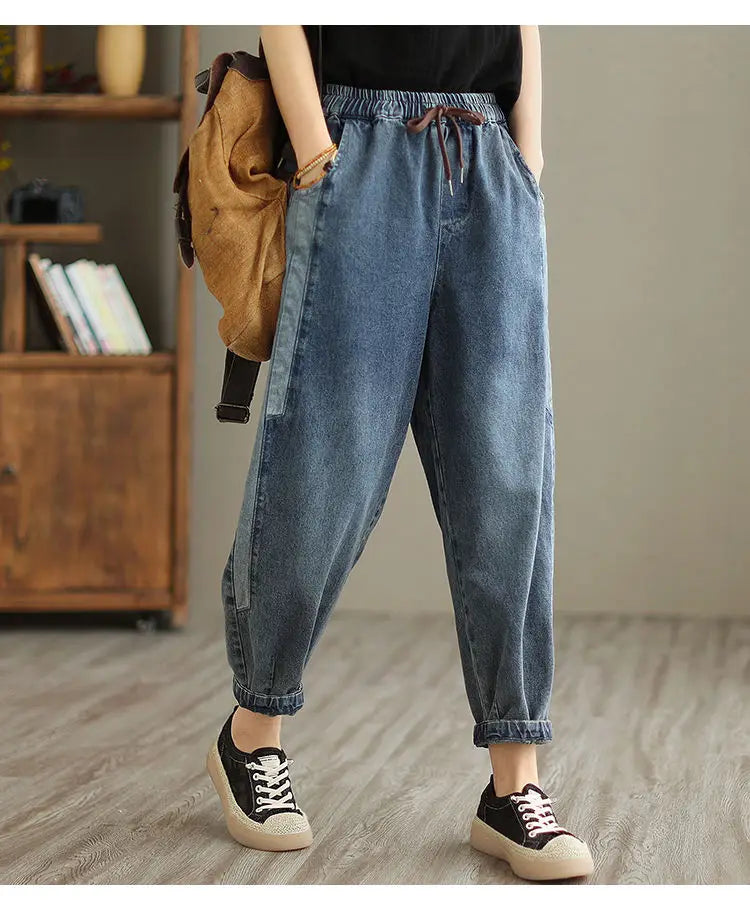 Women's denim harem pants by Jelieora Venture, featuring a relaxed fit and stylish design, displayed on a model.