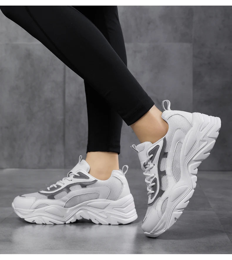 Women's vulcanized platform chunky sneakers by Jelieora Venture, showing the stylish black footwear with thick soles and lace-up design.