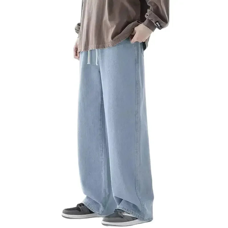 Men's baggy wide-leg Y2K denim jeans by Jelieora Venture, shown with relaxed fit and distressed details in a casual style.